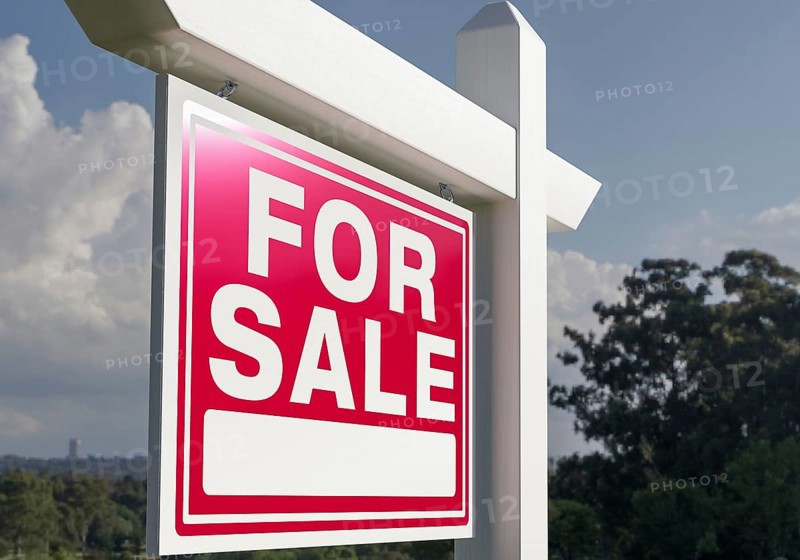 Close-up of house for sale real estate sign