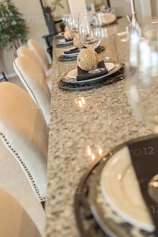 Beautiful abstract of interior kitchen counter place settings and chairs