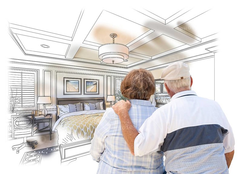 Curious senior couple looking over custom bedroom design drawing photo combination