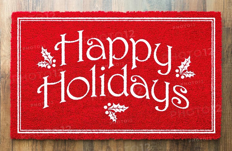 Happy holidays christmas red welcome mat on wood floor background