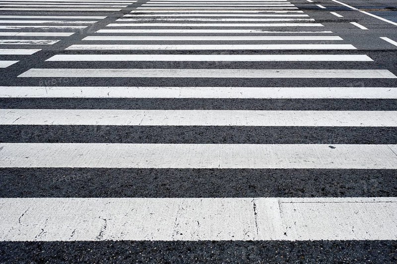 Crosswalk pedestrian crossing on asphalt road in the street