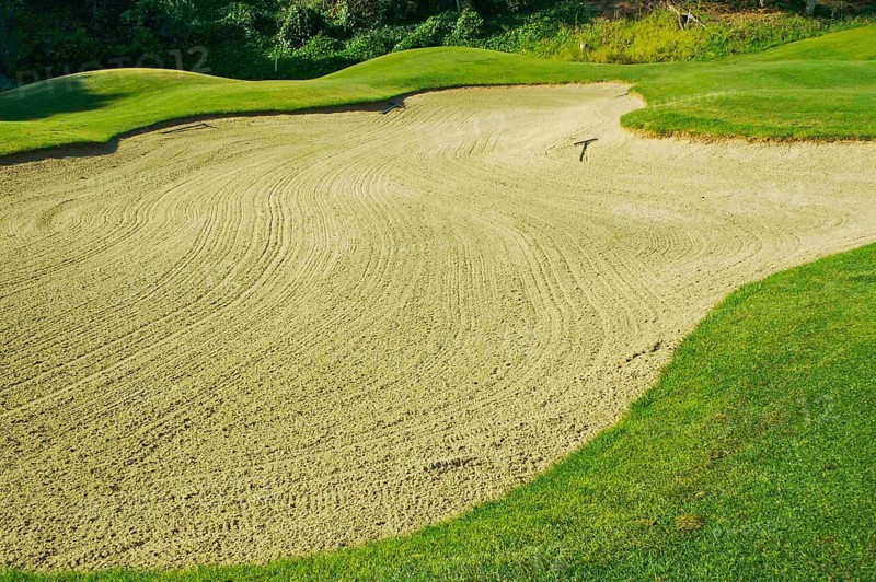 Abstract of golf course and sand bunker