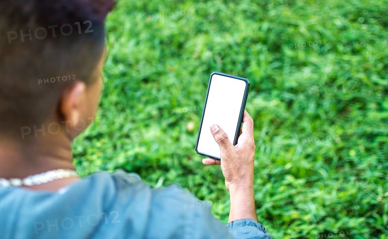 Close up of a man with cell phone in hand