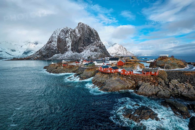 Hamnoy fishing village with red rorbu houses in Norwegian fjord in winter. Lofoten Islands