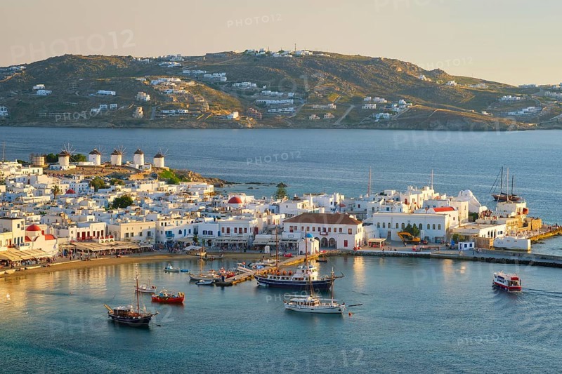 View of Mykonos town Greek tourist holiday vacation destination with famous windmills