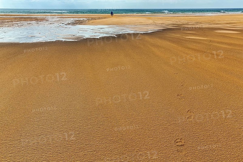 Wind blowing over structures in the sand