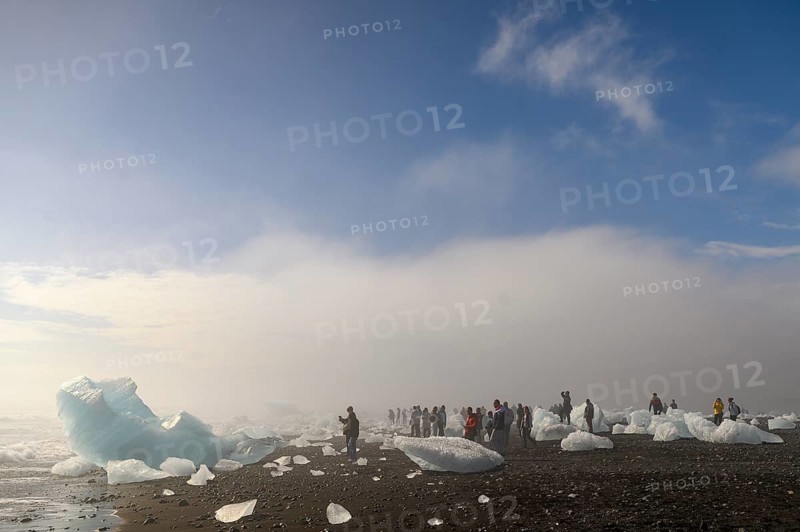 Ice and tourists on the beach