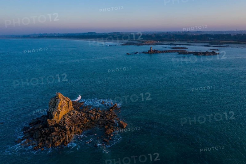 Aerial view of rock formations in the sea in front of the sandy beach Ker Emma shortly in front of sunset