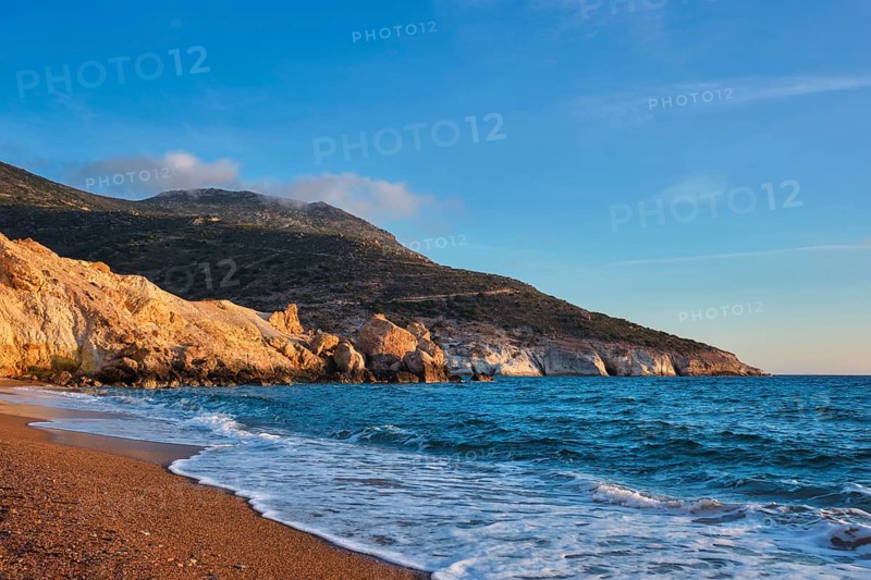 Agios Ioannis greek beach and Aegean sea on sunset