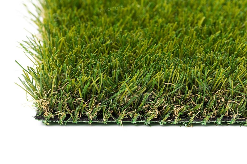 Section of artificial turf grass on white background