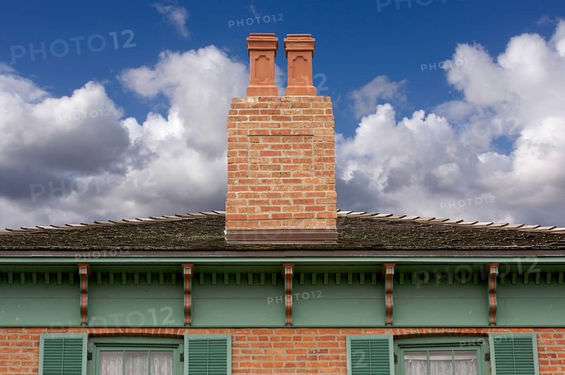 Classic home facade with a dual chimney