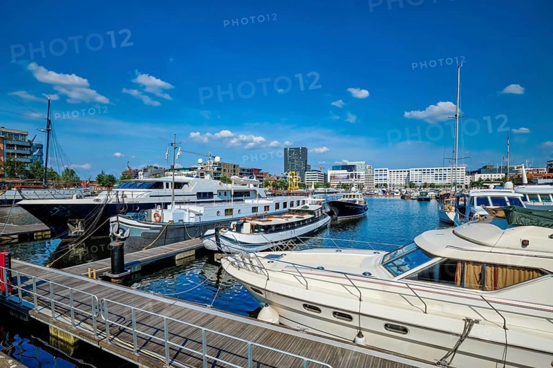 Yachts and boats moored in Willemdock in Antwerp