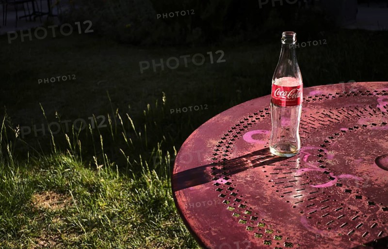 Empty bottle of Coke