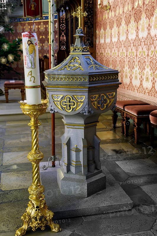 Baptismal font with candle