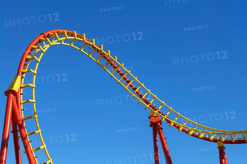 Roller coaster in front of blue sky