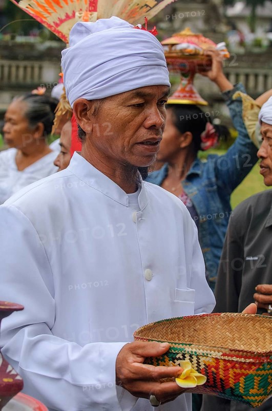 Hindu priest with basket for offerings