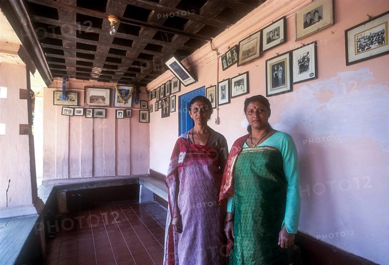 Kodava Women standing in her traditional home in Kodagu