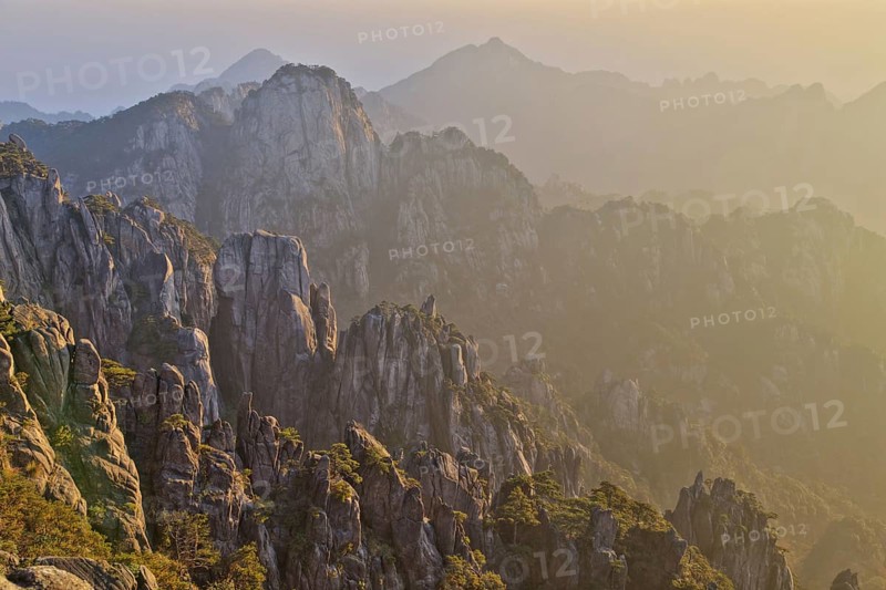 View of mountain range with granite peaks at sunrise
