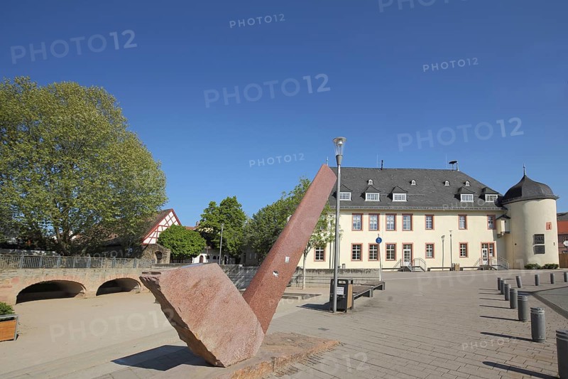 Winery building with witch tower built in 1719 and modern sculpture at the Kellereiplatz in Hofheim