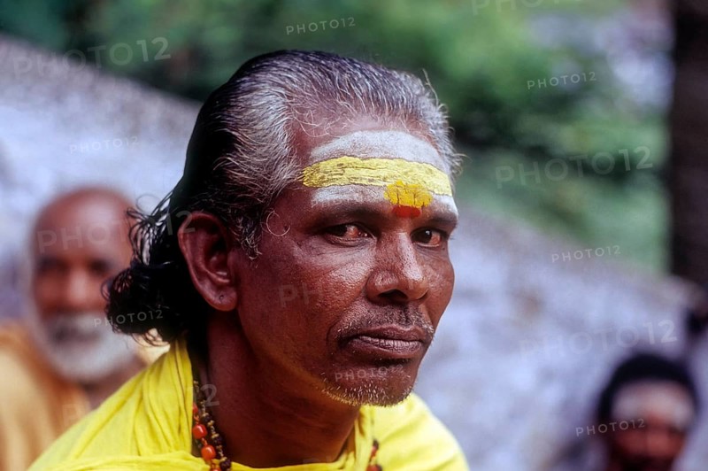 A Sadhu sitting on the steps of Arulmigu Dhandayuthapani Swamy Temple at Palani near Coimbatore