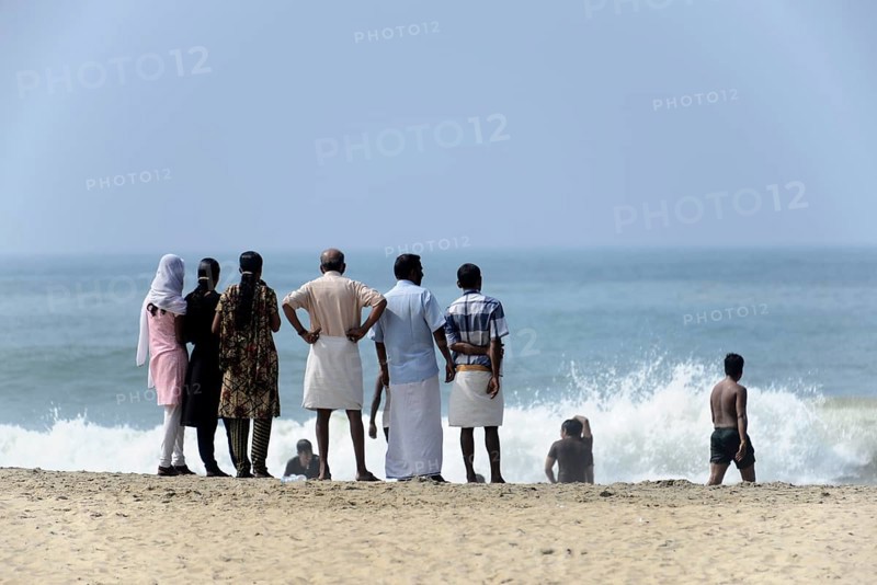 Holidaymakers on the beach of Kovalam