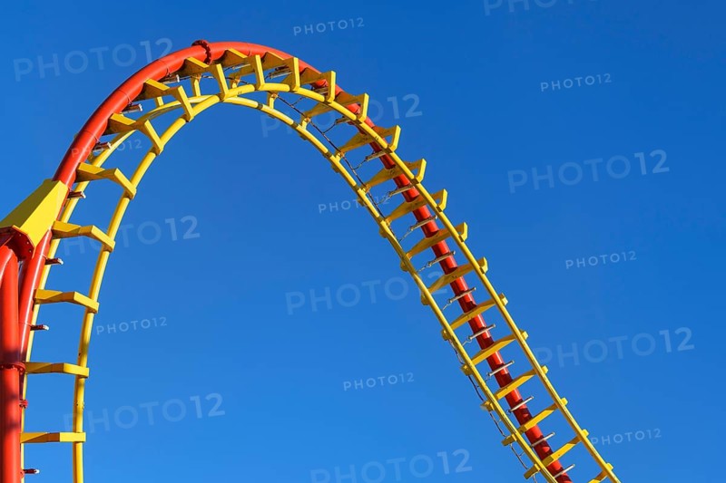 Roller coaster in front of blue sky