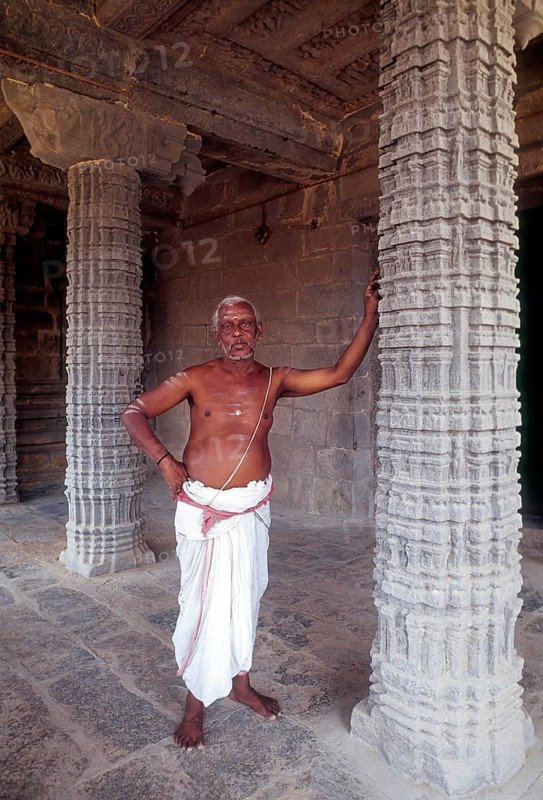 A Priest standing in Kampaheswarar Temple at Thirubuvanam