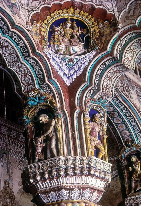 Siva and Parvathi seated on Rishaba or bull. 18th century stucco works and fresco painted pillars of Maratha Darbar hall inside Thanjavur palace complex
