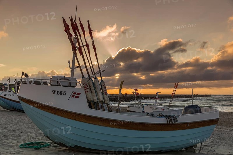 Fishing boats in the evening light at the natural harbour of Vorupoer