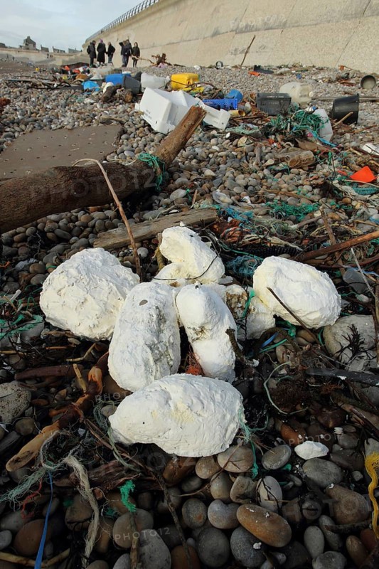Rancid vegetable oil amongst rubbish washed up on beach