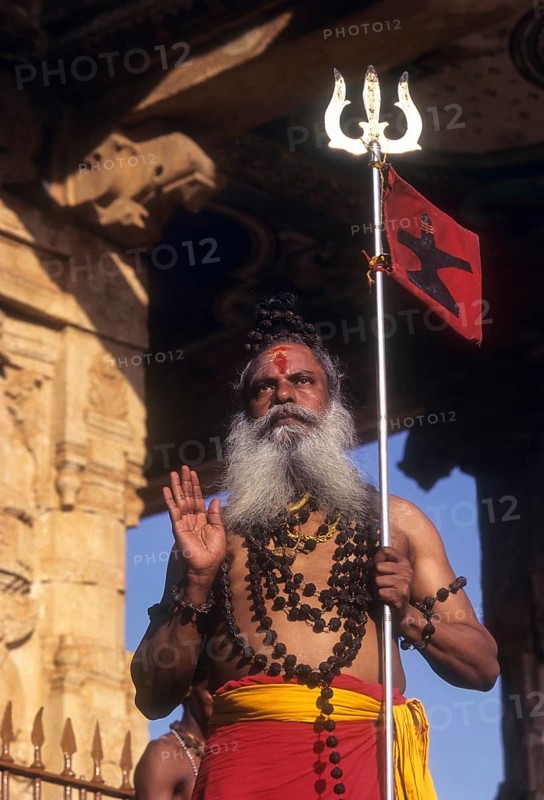 A sadhu standing on the floor of Nandi mandap in Brihadeeswarar Temple