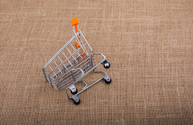 Shopping cart placed on canvas background