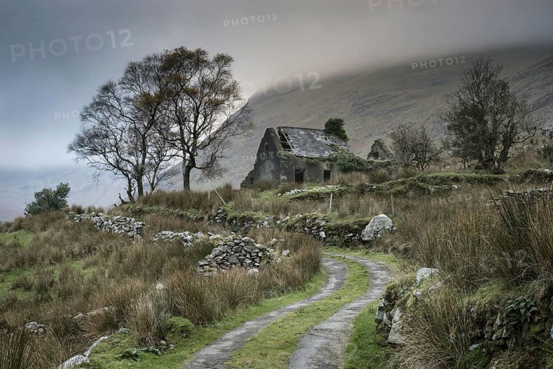 View of drystone walls and abandoned farmhouse