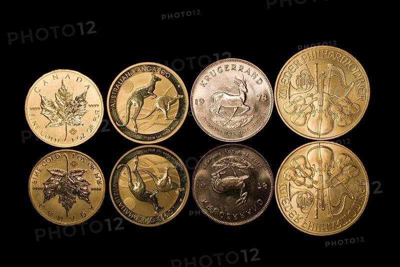 Four mirrored gold coins