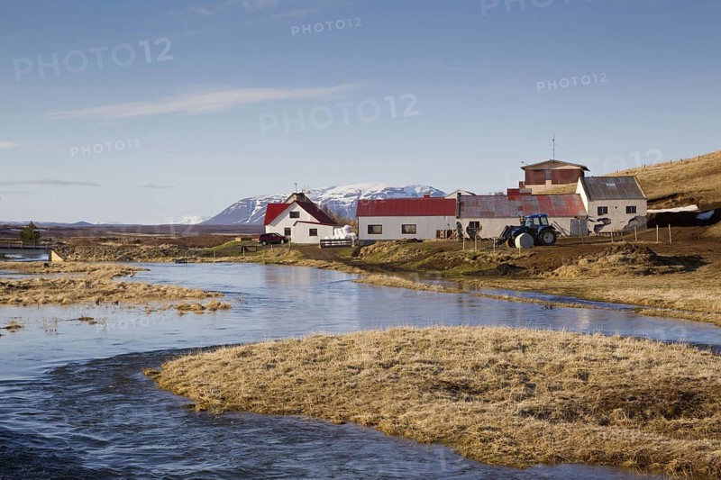 View of river and farm buildings