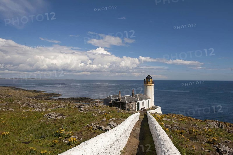 View of coastline and bird observatory housed in former lighthouse