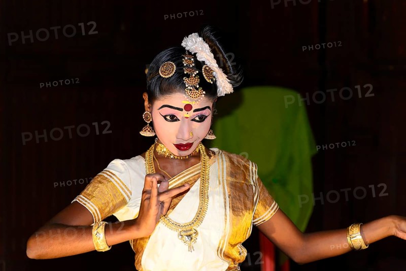 Fully made up and costumed Kathakali dancer performing
