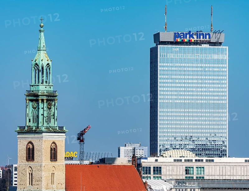 Church tower of St. Mary's Church with the Park Inn Hotel am Alexanderplatz