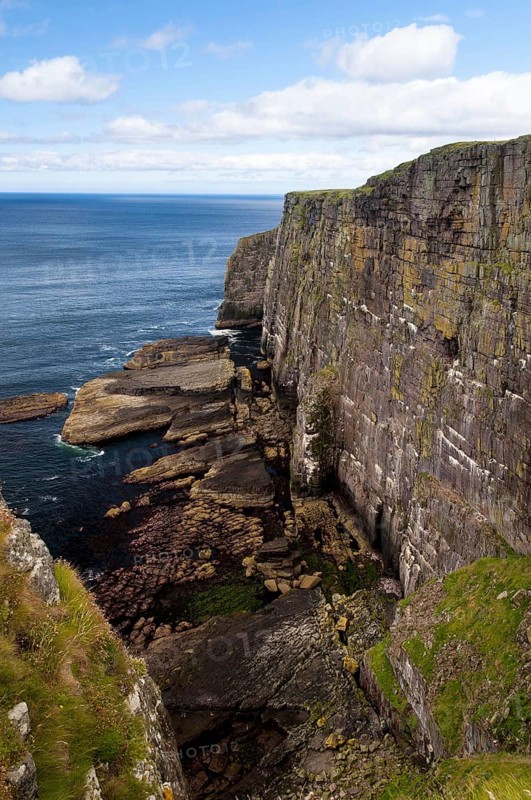 View of Torridonian red sandstone sea cliffs in northwest of island