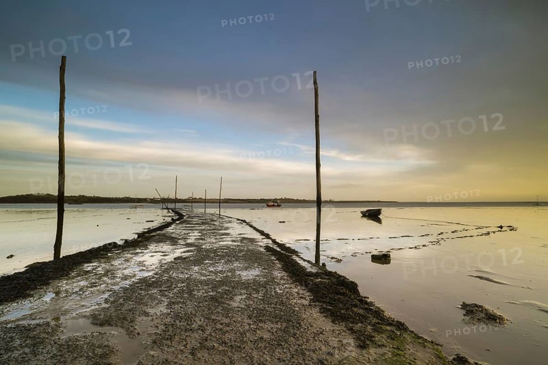 View of causeway and slipway at sunrise