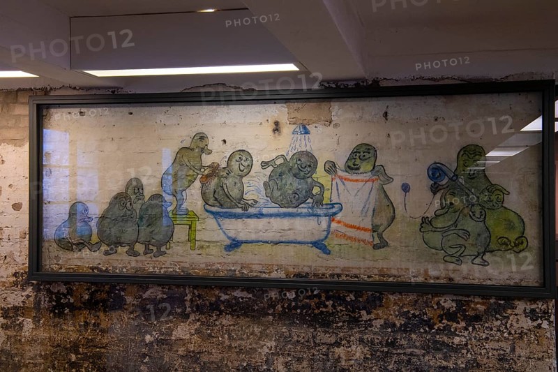 Mural of prisoners in the former potato peeling cellar of the camp kitchen