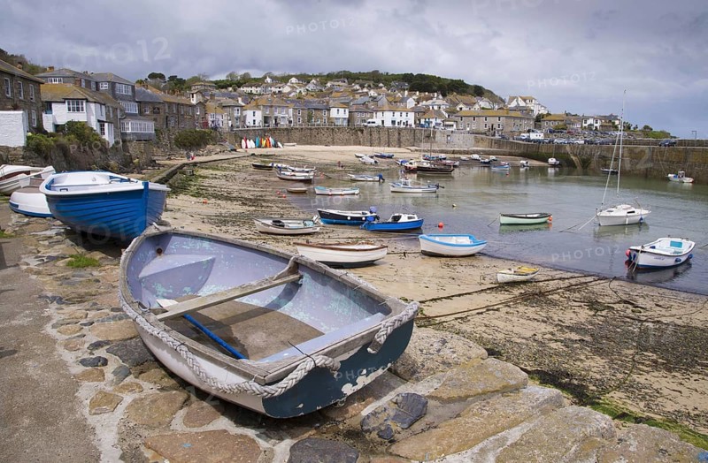 View of boats and fishing village on the coast