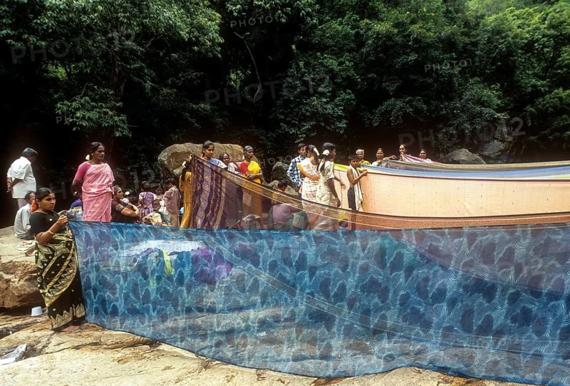 Women drying sarees after bathing River Cauvery