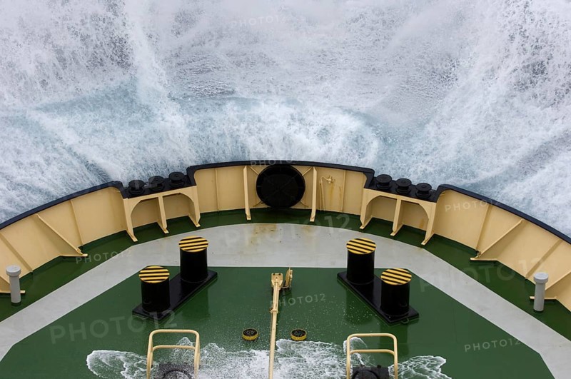 Bow of the icebreaker Kapitan Chlebnikow crashes into a wave in rough seas
