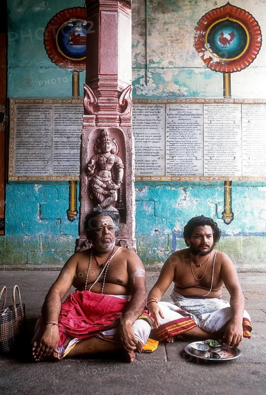 Priests sitting in the corridor of Vaitheeswaran Temple