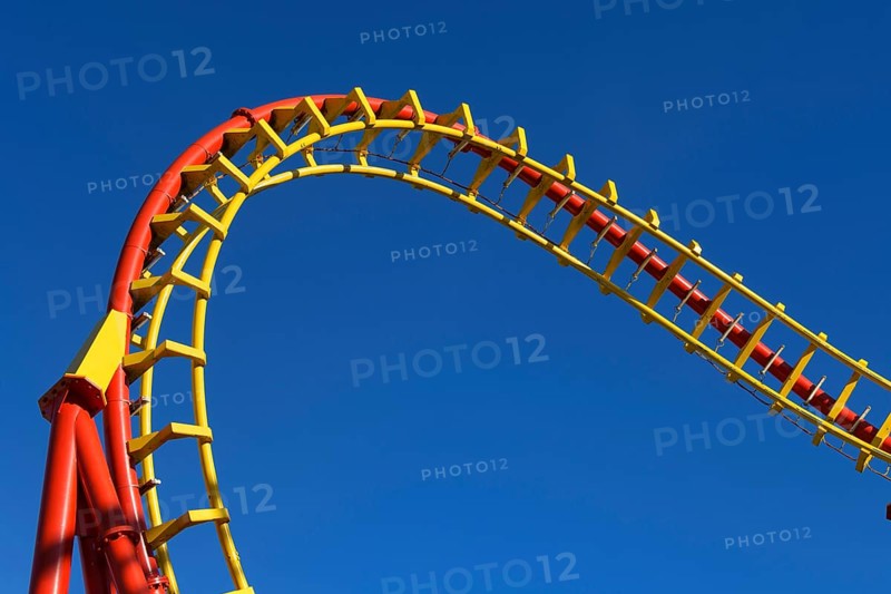Roller coaster in front of blue sky