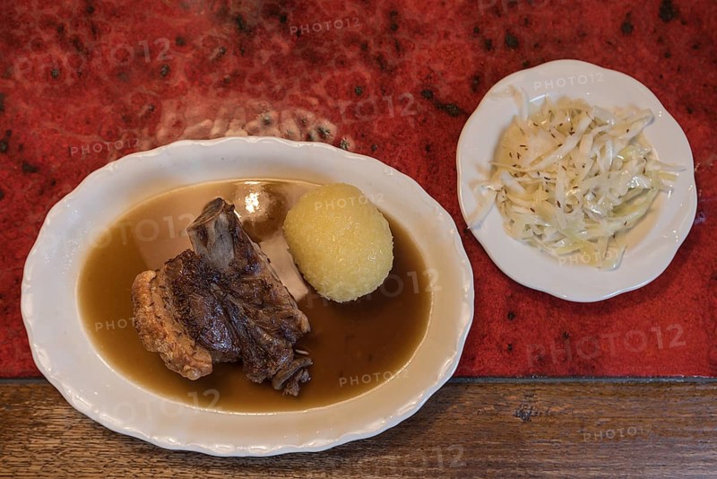 Schaeufele with dumpling and coleslaw served in a Franconian inn