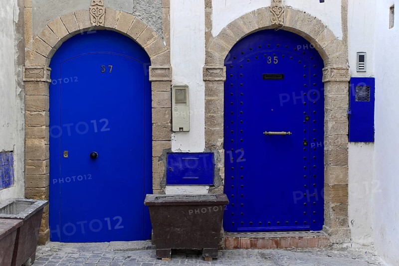 House front with blue entrance door