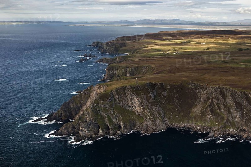 Aerial view of coastline with cliffs and commemorative monument