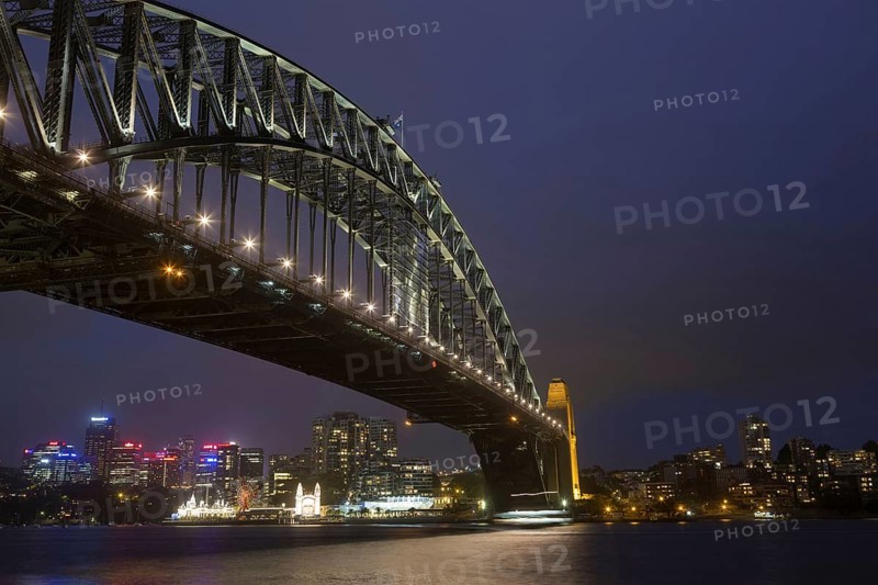 View of bridge and city skyline at night